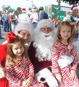 Merli and Reese Sullivan tell Santa what they want at train stop in NSB.